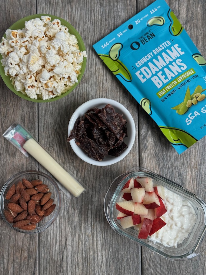 best at work snacks - popcorn, cheese, almonds, cottage cheese with fruit, jerky, edamame